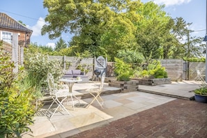 The Clockhouse, North Lopham: Enclosed patio area with outdoor furniture