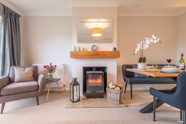 Beachcomber, Holme-next-the-Sea: Cosy modern interiors with electric stove