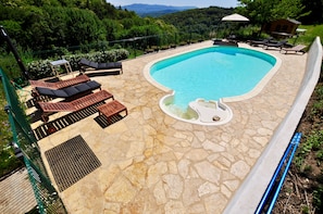 Heated swimming pool, security fencing, mountain views and bathroom facilities