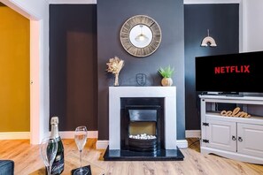 The modern living room benefits from a large corner sofa which can be converted into a double sofa bed, a 40-inch SMART TV with Netflix and plenty of space to sit down and relax.