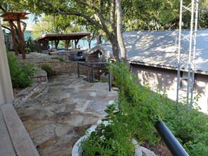 Path down to Lakehouse entrance (~15 steps).  Outdoor kitchen on left.