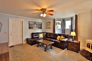 Spacious living room with 50" TV and a sectional with plenty of seating! 