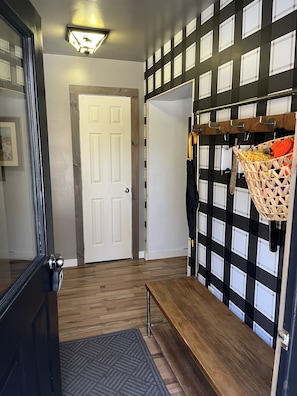 entry foyer with coat and shoe storage 