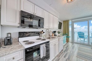 Full kitchen and new light fixtures to bring it up to date