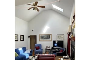 Ceiling fans, large TV & easy chair for relaxing.