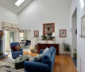 View of living room entering from the sleeping area hallway.