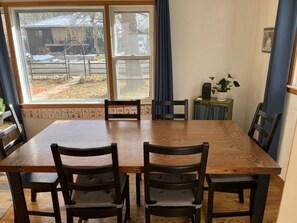 Large reclaimed wood table seats 6 comfortably.