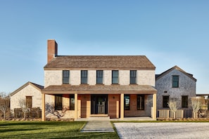 Front of home with parking for multiple cars. 