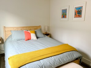 Downstairs bedroom. Queen bed. Walk in closet. 