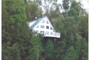 View of house taken from a boat on the River