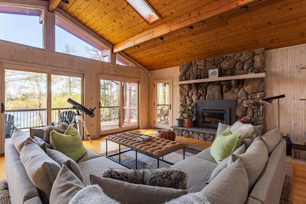 Living room includes beautiful lake views and access to screened porch