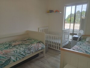 Bedroom 3 - 2x single bed with 2x single bed floor mattress and cot.