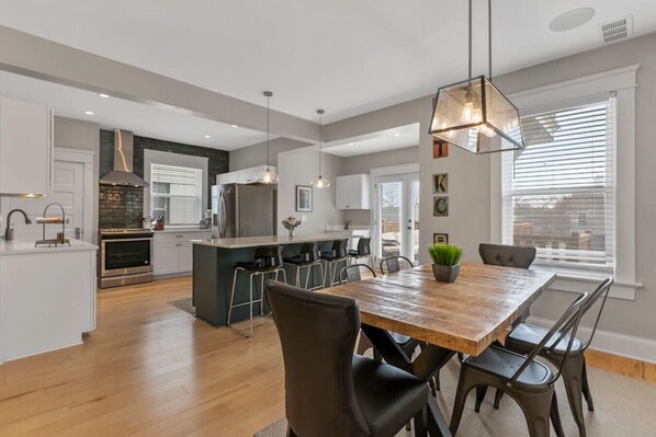 Remodeled, open and very inviting kitchen area with dinning table.