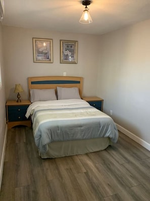 Bedroom featuring a warm queen size bed