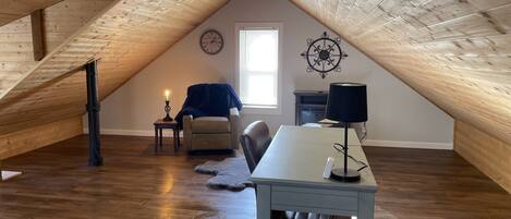 Bonus space with work desk, electric fireplace, cozy corner