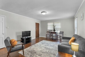 Living Room with Couch, Breakfast Table, Smart TV and Reading Chair