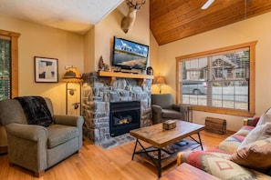 Living room with stone fireplace