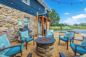 Gather under the stars around our shared gas firepit.