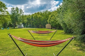 Stretch out and unwind in our peaceful hammock grove.
