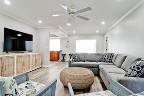 Relax in comfort and style in our inviting living room. Unwind on the plush couch and catch up on your favorite TV shows