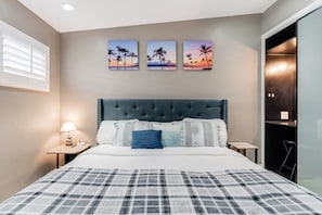 Soothing blue and white accents, large window, and spacious closet.