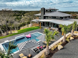 The Dripping Springs Social is a stunning resort-style home and the perfect oasis for your next getaway in Dripping Springs, Texas. 