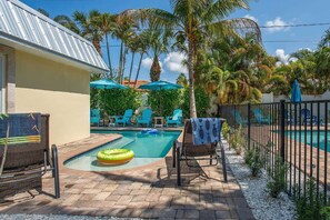 Heated dipping pool shared with other LuLu unit, outdoor shower, and loungers.