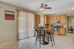 An eating nook in the kitchen with a courtyard view