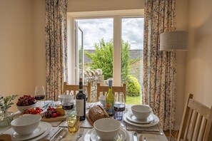 Penhill, Redmire: Dining area with french doors leading out to the garden