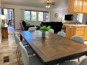 Spacious open floor plan flows into front lake view deck. Dining seats 8.