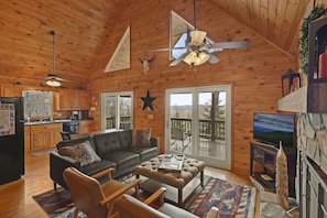 Our Cozy living room with knotted pine walls which inspired 'Knotty By Nature'