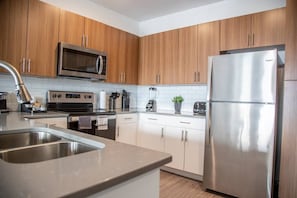 Full stocked kitchen with stainless steel appliances