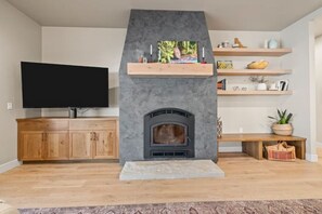 Wood burning fireplace and tv area