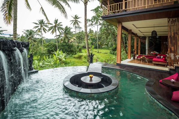 Private infinity pool overlooking Balinese rice fields
