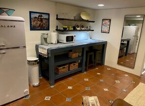 Kitchenette with dishes, microwave and coffeemaker. No cooking capabilities.