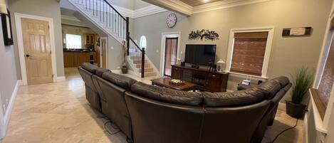 Living room with reclining coach and smart TV