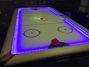 Enjoy a Game of Air Hockey in the Garage Room