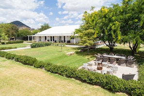 Main house, outdoor dining and fire pit space