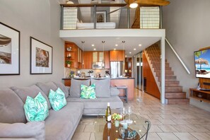This open-concept living room blends playful coastal touches with lofty elegance and warm island hospitality PKC-404