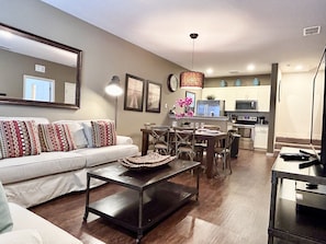 Cozy living room with smart TV and beautiful decor.