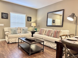 Living room with inviting decor and lighting.