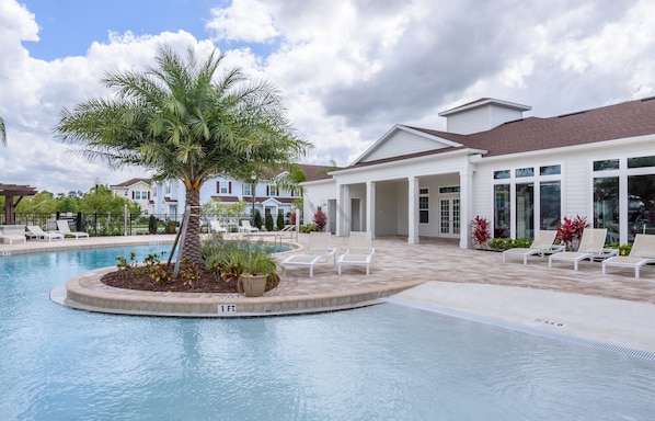 Pool area with comfortable loungers for relaxation.