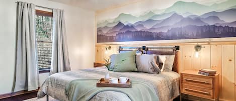 Delight in the comfort of a brand new king bed beneath a beautiful mural accentuated by brand new tongue and groove. Snuggle up, close your eyes, and drift to sleep under majestic mountains!
