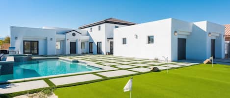 Backyard with private pool, mini golf, jacuzzi, grill, and more