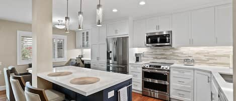 Newly remodeled kitchen with custom cabinets and top of the line appliances.