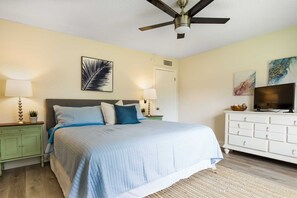 Modern coastal bedroom, king bed and smart TV