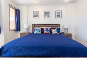 Master Bedroom: King Bed, 2 nightstands, reading lamps, ceiling fan, full-size mirror, and SmartTV.