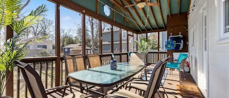 How nice to sit and eat meals on a screened in deck.