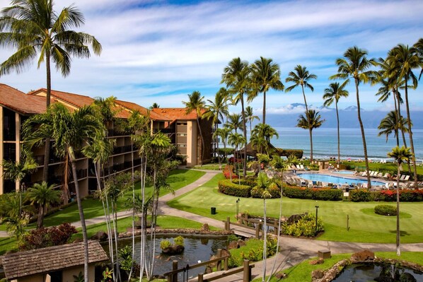 Clouds kiss the mountains, palms sway in rhythm, and your perfect Maui day unfolds by the pool and sea PKC-403