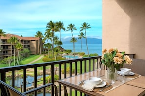 Wake up to panoramic views of the ocean, tropical gardens, and poolside bliss from your breezy, private lanai PKC-403